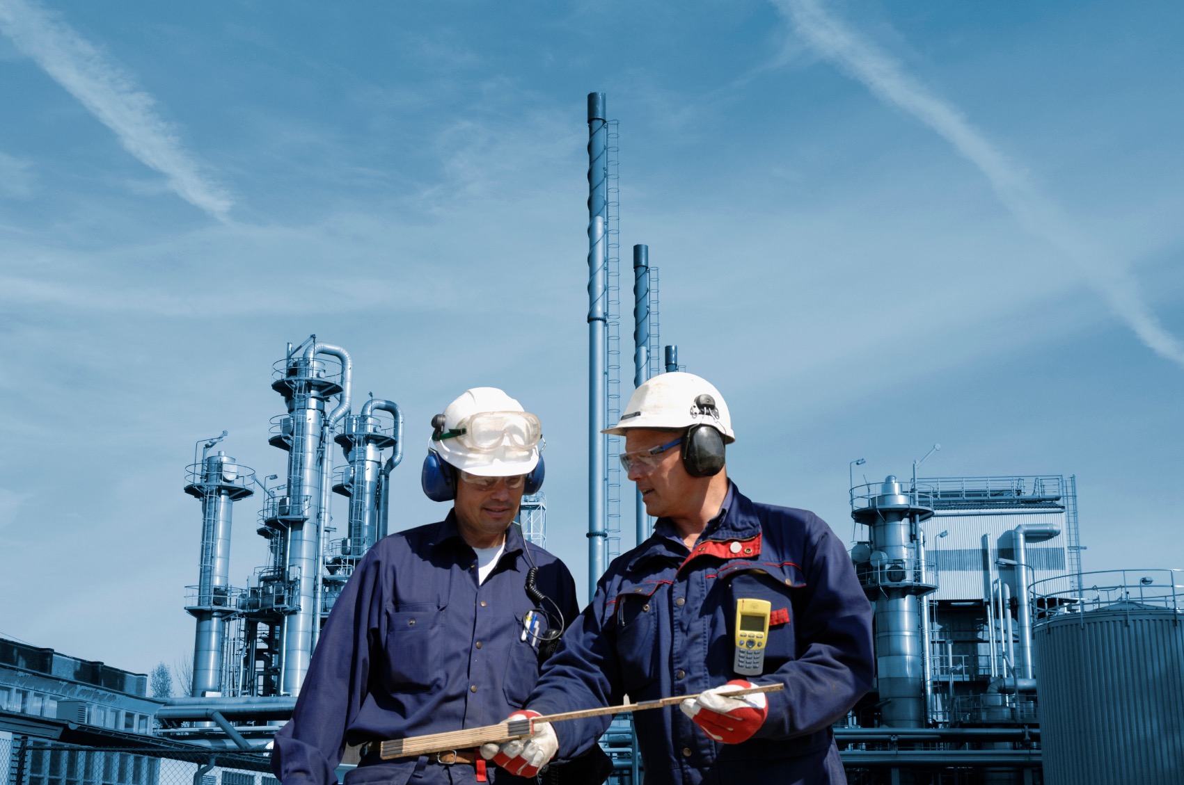 Engineers discussing work at an industrial facility
